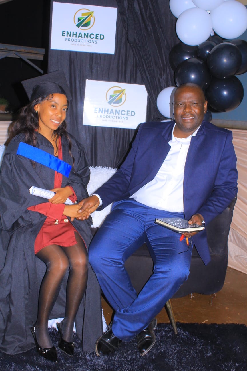 A graduate receiving recognition at an Enhanced Productions ceremony